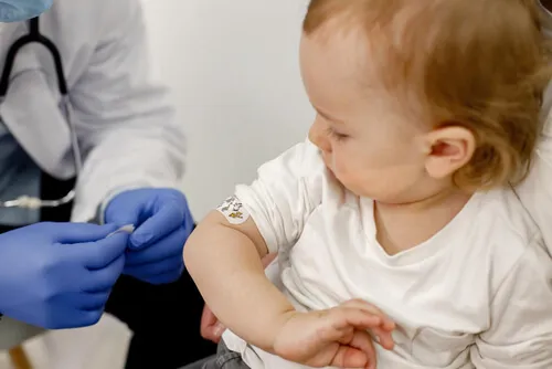 baby-shoulder-with-stick-bandaid-Rotavirus-vaccine.webp