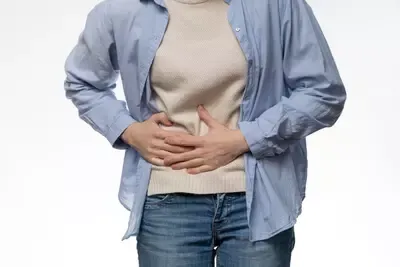 front-view-patient-experiencing-abdominal-pain.webp