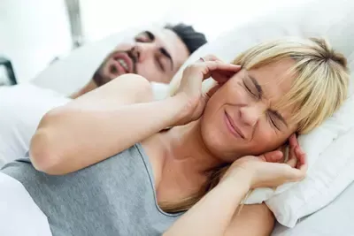 young-woman-who-can-sleep-because-her-husband-snores