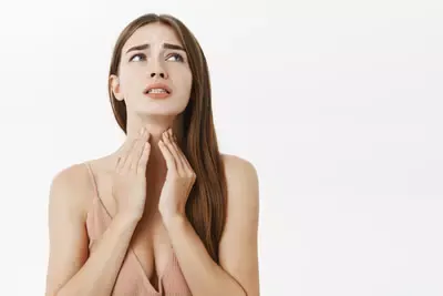 woman-getting-ill-before-important-meeting-feeling-discomfort-suffering-from-pain-throat-touching-neck-frowning-clenching-teeth-from-terrible-feeling-posing