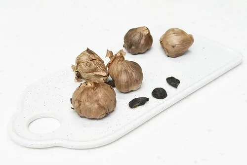 on-the-cutting-board-Black-garlic.webp