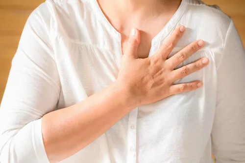 woman-clutching-her-chest.webp