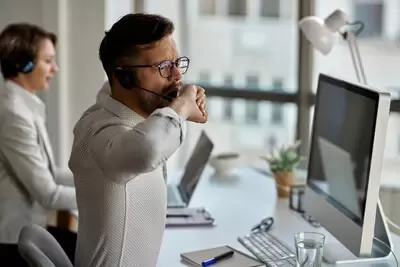 yawning-while-working-office.webp